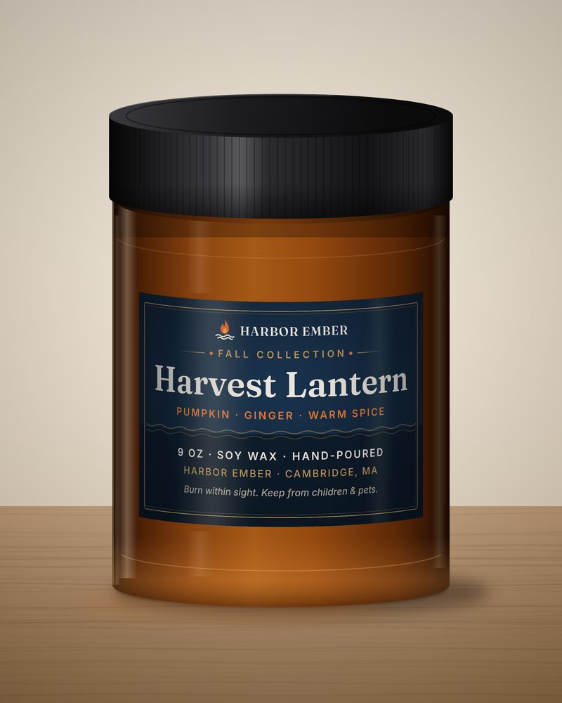 Harbor Ember Harvest Lantern 9 oz soy candle in an amber jar with a black lid