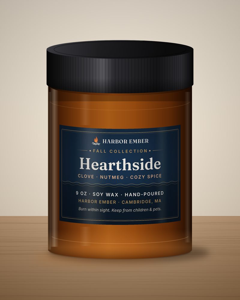 Harbor Ember Hearthside 9 oz soy candle in an amber jar with a black lid
